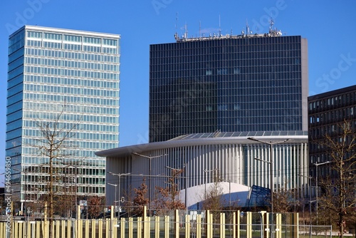  Office buildings in Kirchberg, Luxembourg - modern high rise buildings on a sunny summer day with Philharmonie in front