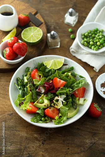 Healthy leaf salad with strawberry and avocado