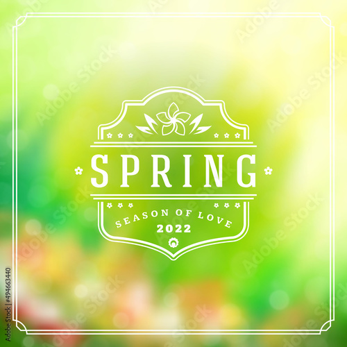 Spring badge vector typographic design greeting card. Spring blurred lights background and flowers. Eps 10.