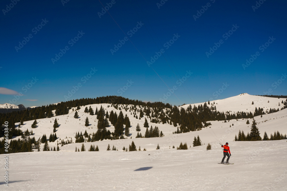 Kite Skiing. photo during the day in a beautiful winter setting.
