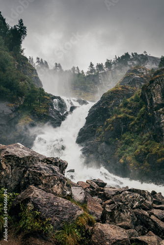 panorama view of waterfall latefossen in norway on a rainy summer day photo