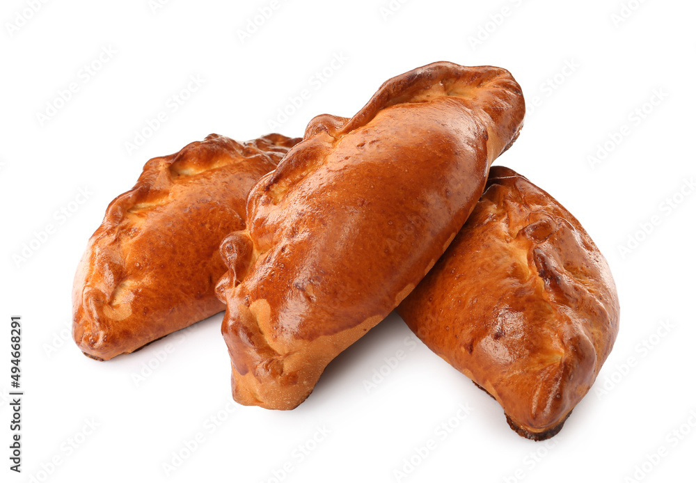 Many delicious baked patties on white background