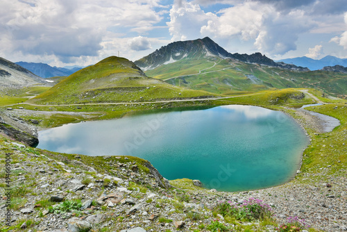 Majestic nature landscape with clear lakes at French Alps mountains near Arcs 2000 ski station. Summer in Savoie, France. Natural beauty stunning earth background. 
