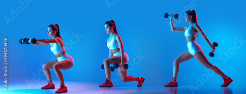 Fototapeta Naklejka Na Ścianę i Meble -  Morning exercises. Young sportive woman training with sports equipment isolated on blue studio background in neon light.