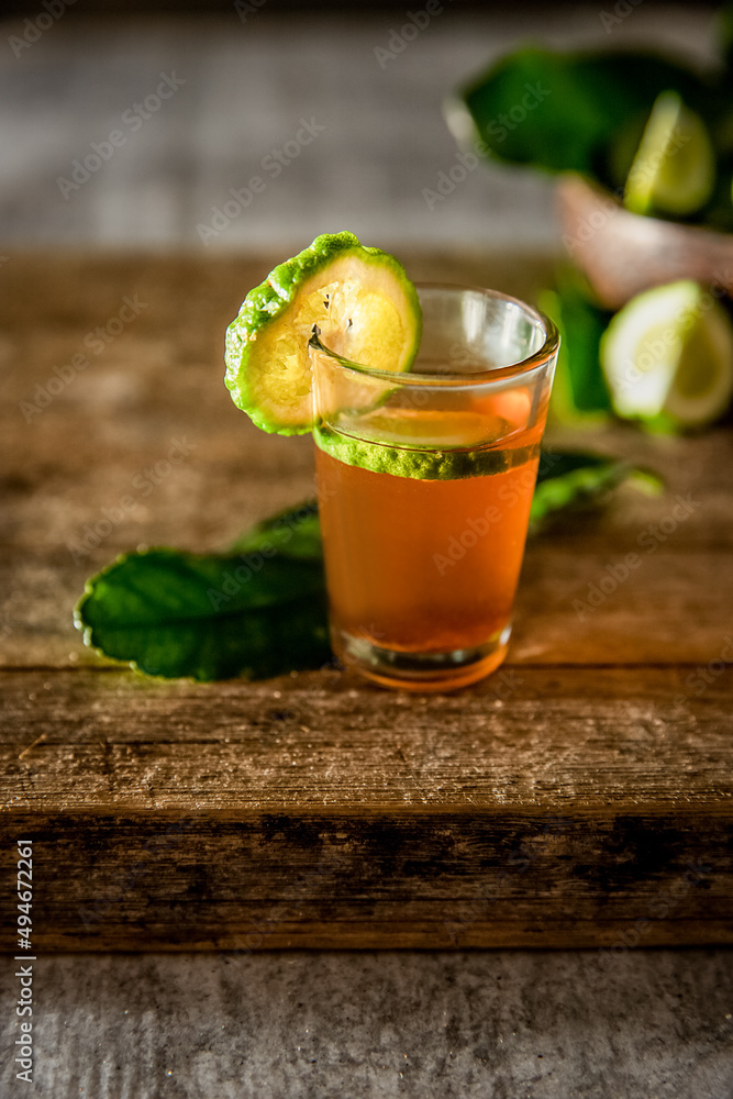 rum in a glass shot and bottle on dark wooden background, wealthy luxury bar atmosphere rum in a glass shot and bottle on dark wooden background, wealthy luxury bar atmosphere