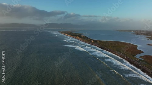 Rossbeigh Beach, Kerry, Ireland, March 2022. Drone pushes north along the strand on Dingle Bay with Inch, An Mhaoilinn and Castlemaine Harbour in the distance. photo