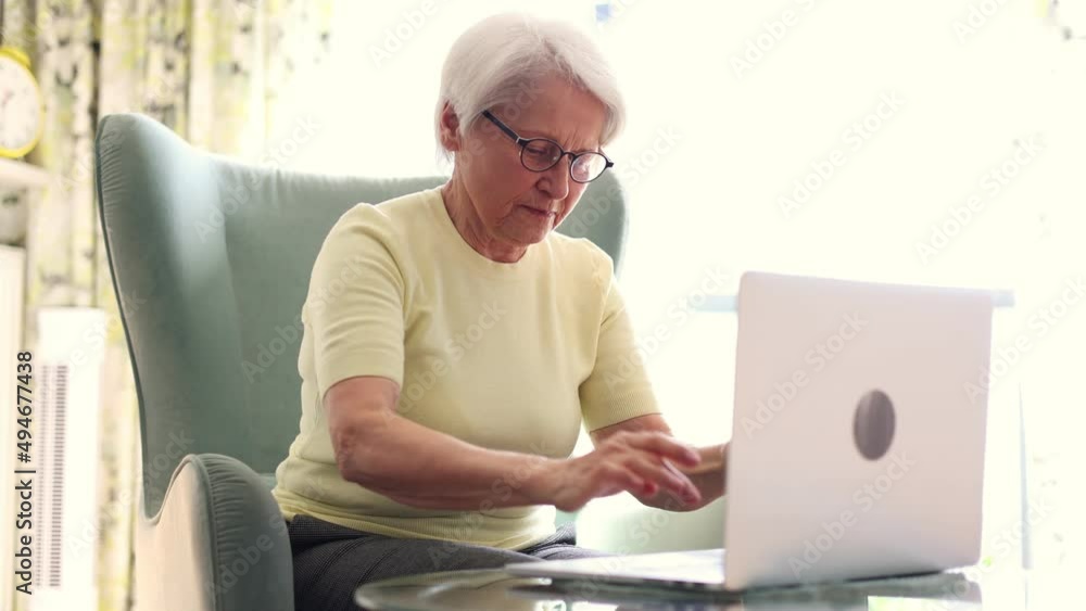 Senior woman using laptop at home
Senior woman using laptop at home