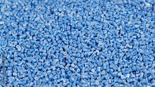 Tablou pe pânză Secondary granule made of polypropylene, Blue Plastic pellets crumbles to the table