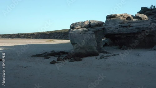 Rock Formation Found on a Beach in Langebaan Lagoon at West Coast National Park, South Africa - Orbiting Drone Shot photo