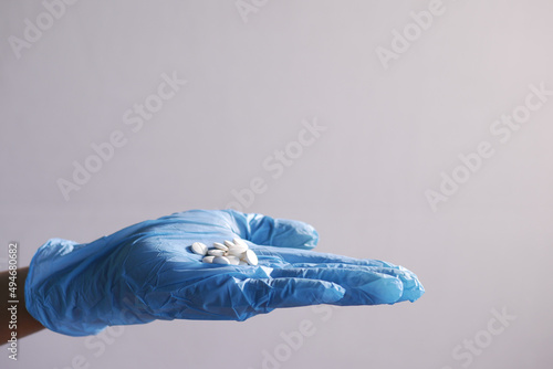 hand in a latex gloves white medical pills on hand  © Towfiqu Barbhuiya 