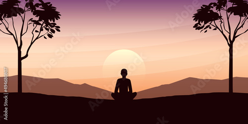 mediating person in yoga pose on beautiful landscape with big trees and mountain view at sunset