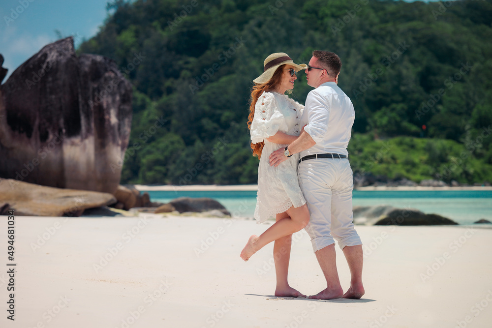 Romantic couple on the paradise tropical beaches of Seychelles