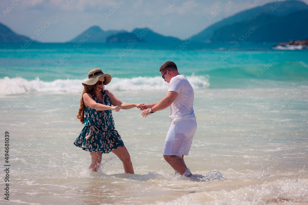 Romantic couple on the paradise tropical beaches of Seychelles Romantic couple on the paradise tropical beaches of Seychelles