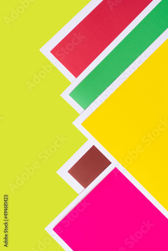 bright geometric background with multicolored paper corners.