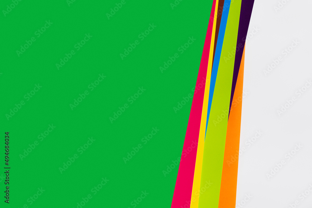 simple geometric background with multicolored stripes and green copy space. simple geometric background with multicolored stripes and green copy space.