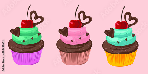 Delicious cupcake with cream, chocolate hearts and cherry on the top
