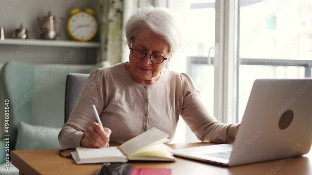 Senior woman using laptop at home
Senior woman using laptop at home