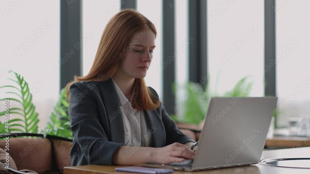 financial specialist of big modern company is working in office, young pretty lady is sending email by laptop financial specialist of big modern company is working in office, young pretty lady is sending email by laptop