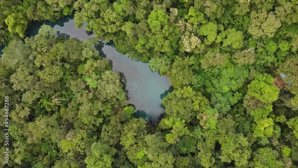 HUATULCO, MEXICO: Flying over the forest and road in the beautiful vacation place Huatulco in the south of the Mexican littoral. HUATULCO, MEXICO: Flying over the forest and road in the beautiful vacation place Huatulco in the south of the Mexican littoral.