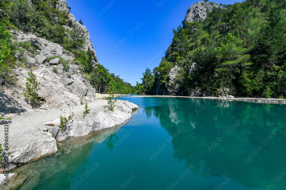 Goynuk canyon in Antalia, Turkey with turquoise river water and mountains. 