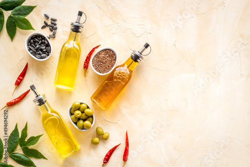 Cooking oil in bottles. Sunflower olive and sesame oil with ingredients