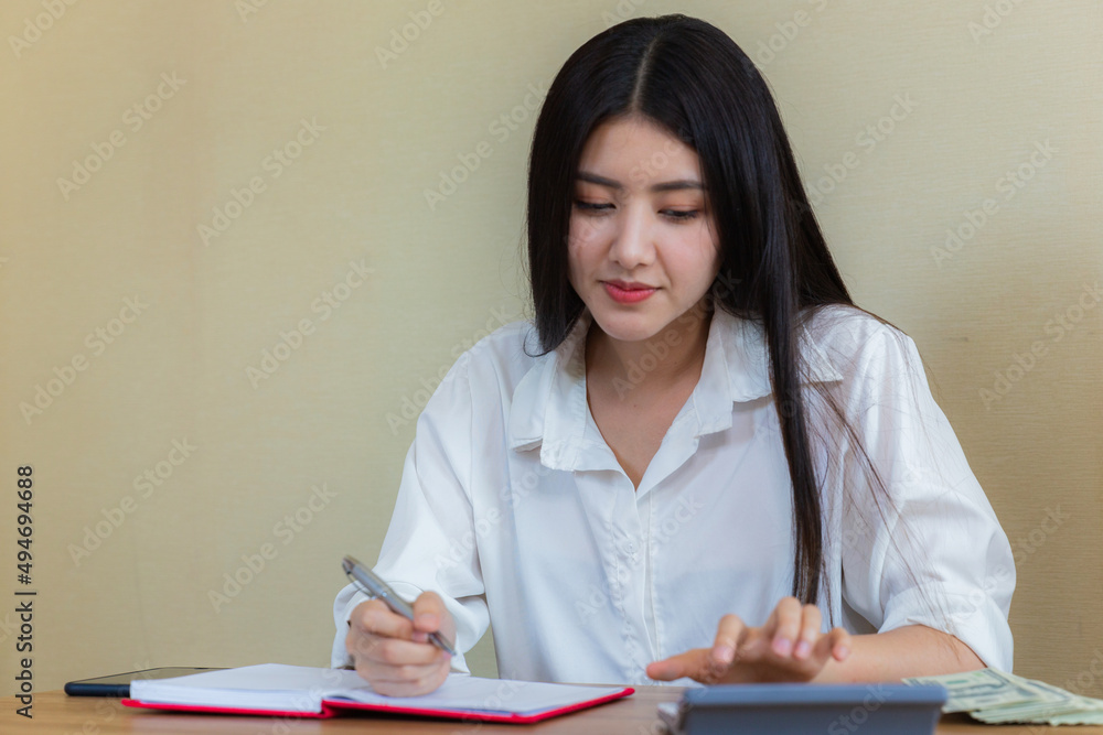 Asian young woman startup small business online at home and packing box for delivery online to customer. Asian young woman startup small business online at home and packing box for delivery online to customer.