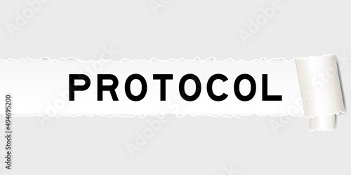 Ripped gray paper background that have word protocol under torn part
