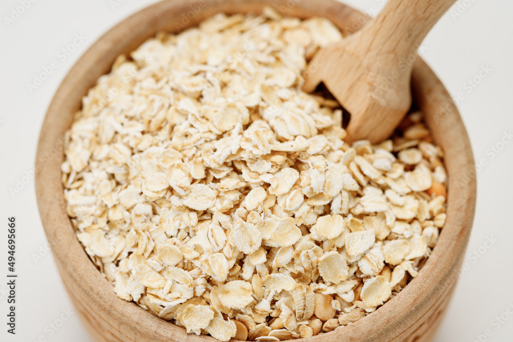 Оatmeal in bowls and bags isolated on a white background. High quality photo Оatmeal in bowls and bags isolated on a white background. High quality photo