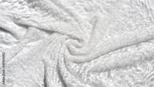 White terry towel background with water ripples over it | Beauty product background shot for its advertisement