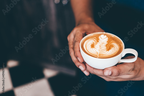 Tableau sur toile Cup of coffee latte art with coffee shop.