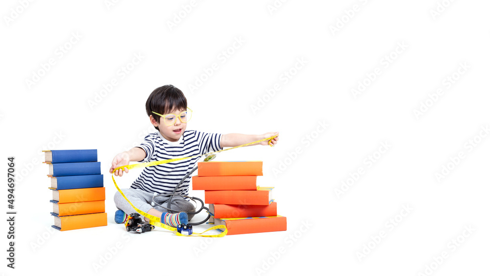 little boy wearing glasses with books on white background, education concept. little boy wearing glasses with books on white background, education concept.
