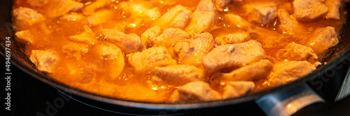 chicken meat in tomato sauce curry in frying pan cook meal fresh poultry meat portion healthy meal food diet snack on the table copy space food background rustic top view