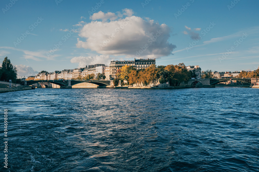 view of the streets of paric from the seine in autumn