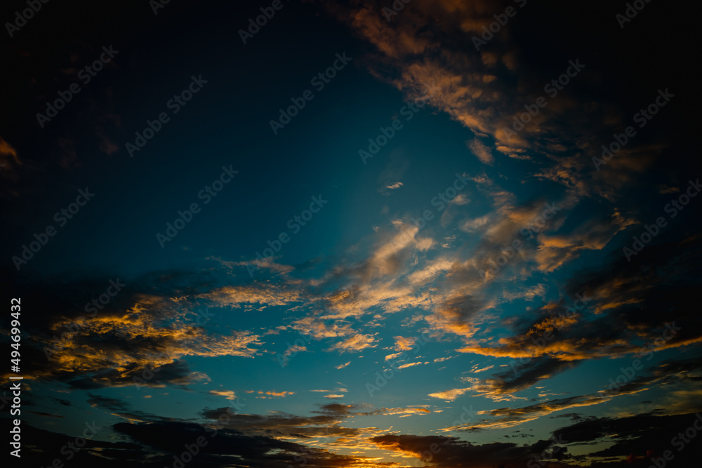 Fototapeta premium Small clouds scattered in the blue sky.
