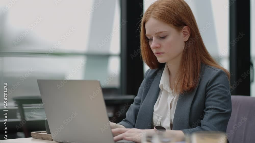 serious female lawyer is working with laptop in her office, specialist of legal department in modern company serious female lawyer is working with laptop in her office, specialist of legal department in modern company