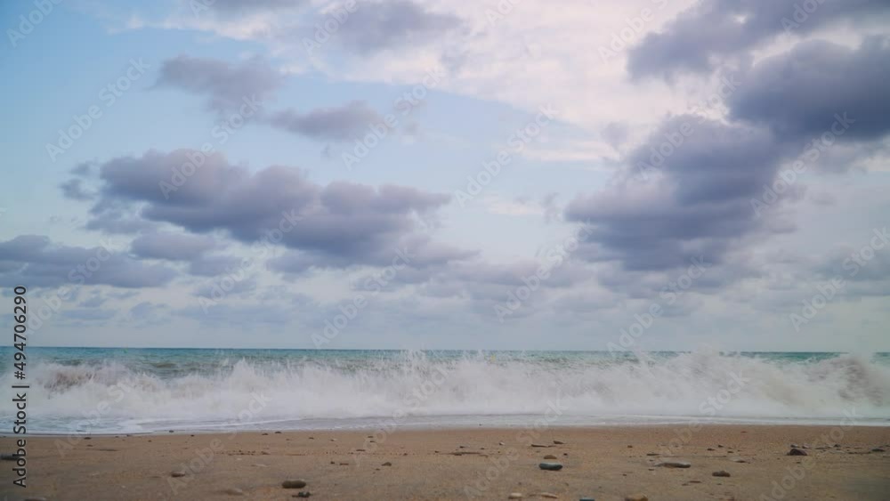 Waves washing ashore on a tropical beach with cloud blue skies and beautiful turquoise waters. Waves washing ashore on a tropical beach with cloud blue skies and beautiful turquoise waters.