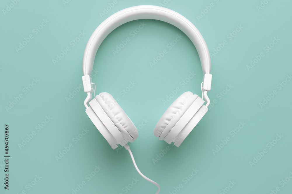 Modern white headphone on yellow background. Music concept. Modern white headphone on yellow background. Music concept.