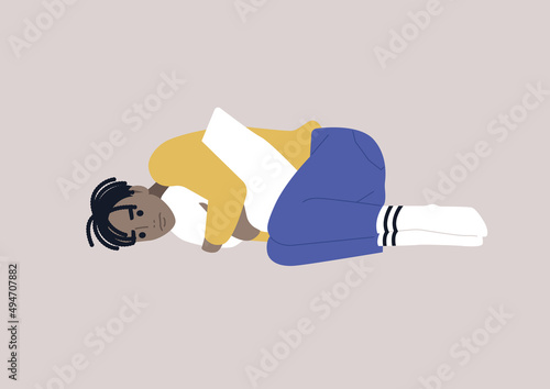 A young male African character squeezing a pillow, grief and sorrow concept, depression and anxiety