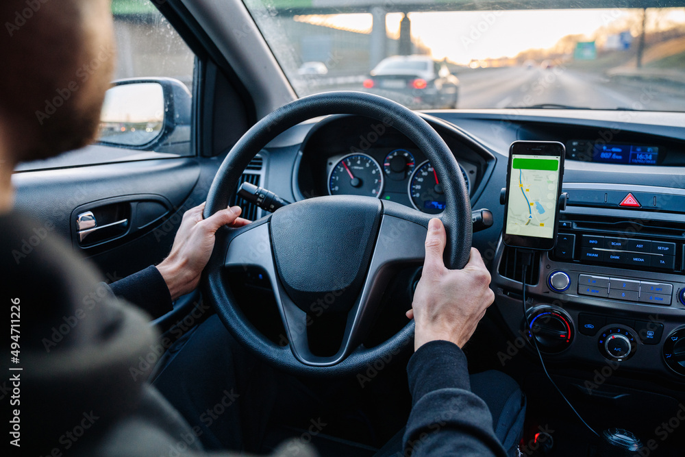 Navigation auto map system. Global positioning system on smartphone screen in auto car on travel road. GPS navigation with smartphone application system. Navigation auto map system. Global positioning system on smartphone screen in auto car on travel road. GPS navigation with smartphone application system.