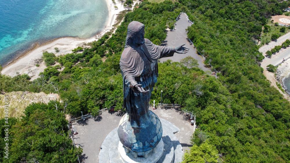 The Famous Statue Of Jesus Christ Cristo Rei Surrounded By Greenery 