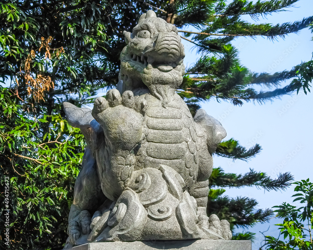 Sha Tin, Hong Kong, China - September 19 2019: Ten Thousand Buddhas Monastery, stone chinese dragon sculpture