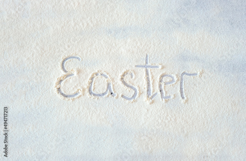 Easter. Easter inscription on flour. Easter theme. Copy space.