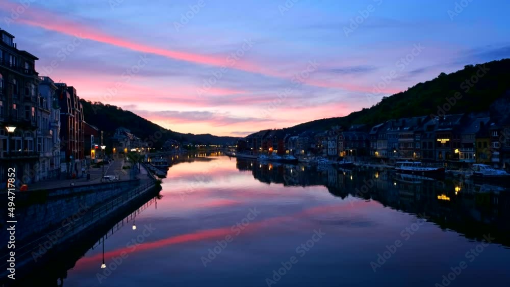 View of picturesque Dinant city over the Meuse river Dinant is a Walloon city and municipality located on the River Meuse, in the Belgian province of Namur on sunset View of picturesque Dinant city over the Meuse river Dinant is a Walloon city and municipality located on the River Meuse, in the Belgian province of Namur on sunset