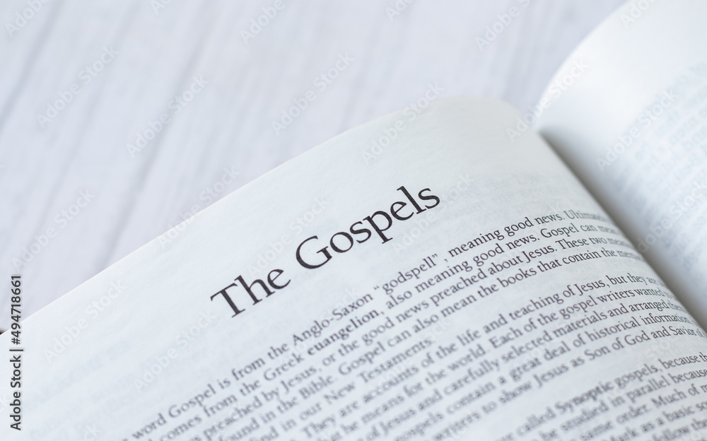 The gospels message, open Holy Bible Book isolated on white background, a closeup. The Christian biblical concept of New Testament Scriptures for forgiveness and salvation from God Jesus Christ. The gospels message, open Holy Bible Book isolated on white background, a closeup. The Christian biblical concept of New Testament Scriptures for forgiveness and salvation from God Jesus Christ.