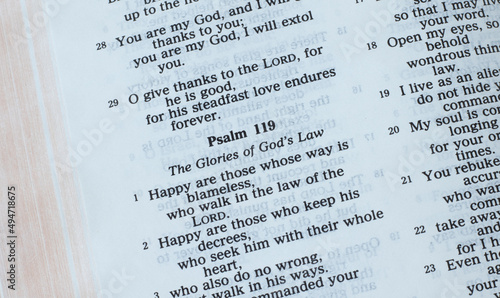 The Law of God, psalm 119, open Holy Bible Book closeup. The Christian biblical concept of glory and praise to God Jesus Christ for the blessing for His sacred Law. photo
