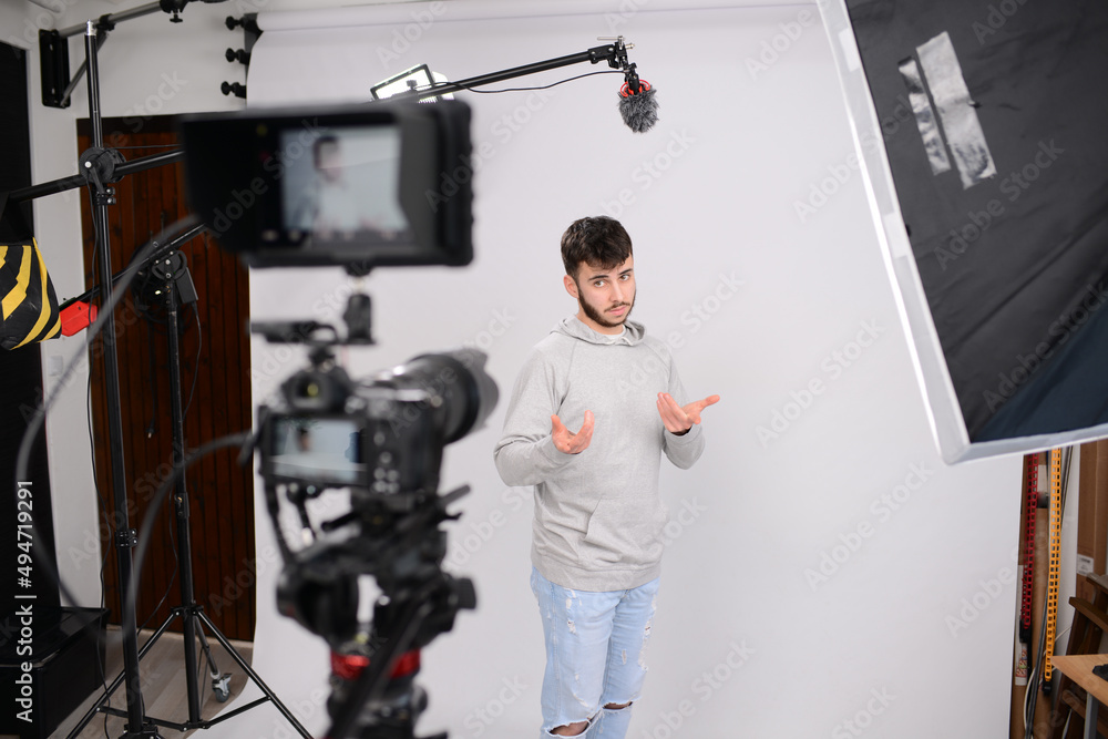 young man video camera operator making interview in professionnal broadcast tv movie studio film production young man video camera operator making interview in professionnal broadcast tv movie studio film production