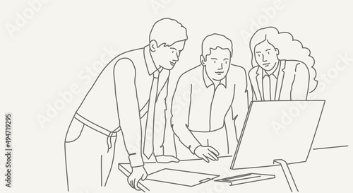 Workspace with business people working together at the computer.