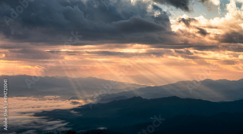 Fototapeta Naklejka Na Ścianę i Meble -  Beautiful dramatic sunrise shining on mountain with foggy in the valley at national park