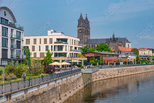 View over new modern houses at historical downtown in Magdeburg at Elbe river bank, Germany, at blue sky and sunny Spring day. © neurobite