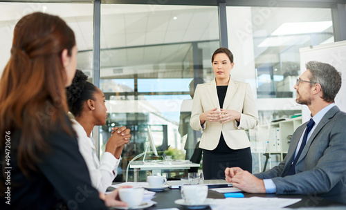 Bringing her expertise into the presentation. Cropped shot of a group of business colleagues meeting in the boardroom.